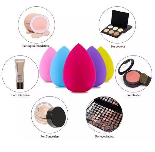 Set of colorful makeup sponges with application examples on a white background