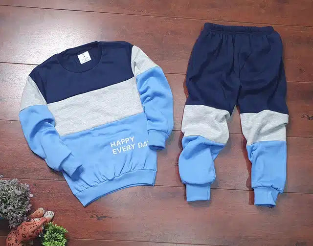 Color-blocked sweatshirt and pants set on a wooden floor